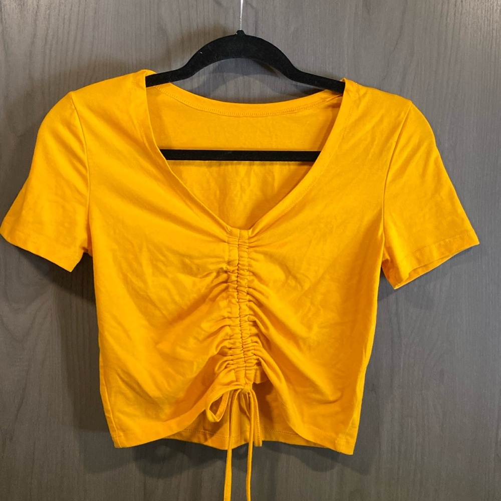 Adjustable cinch crop